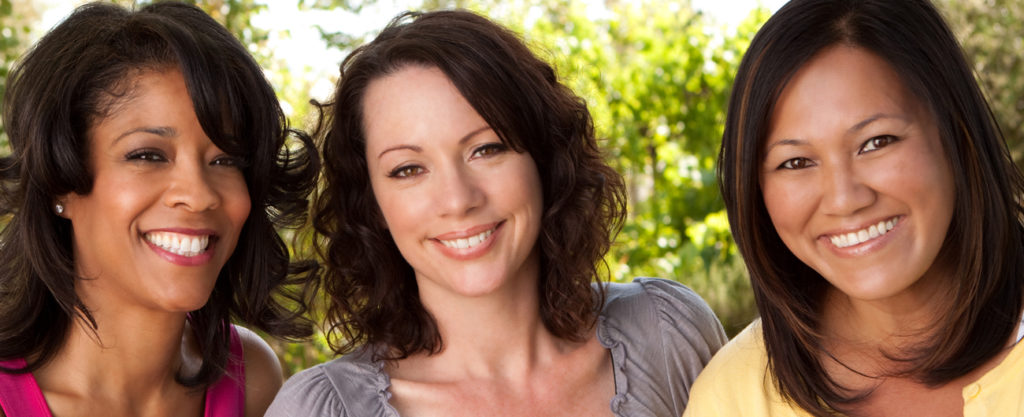 three smiling women